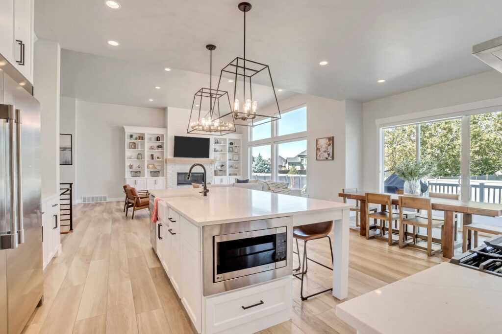 A modern kitchen with a central island and sleek appliances.